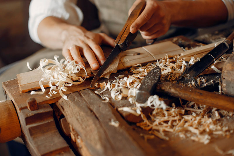 handsome-carpenter-working-with-wood